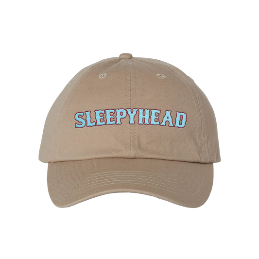 Beige cap with 'SLEEPYHEAD' text on a white background